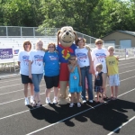 Dollar Dog leads the way for the NCACU team at the Houghton Lake Relay for Life walk.